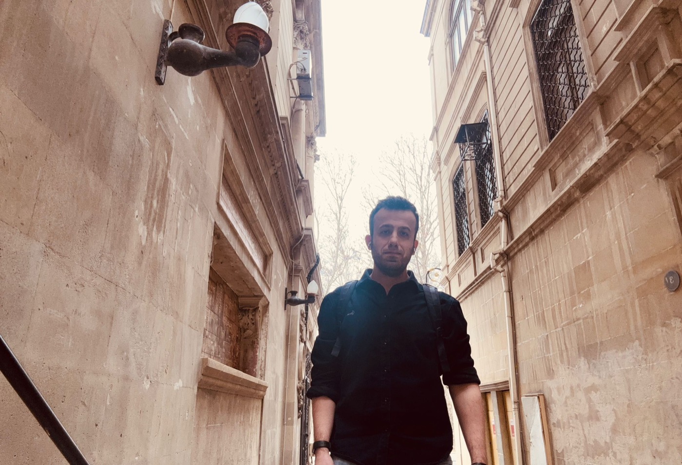 Harun Karahan walking in a city street